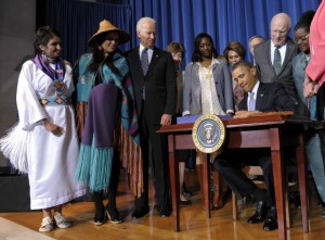 Barack Obama signing the Violence Against Women Act on Women's Day in 2013