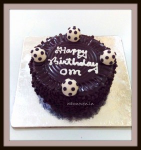 Chocolate cake with fondant football toppers