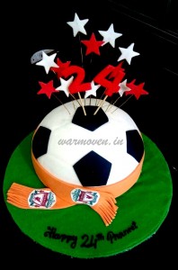 Football shaped cake with team scarf