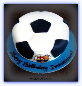 Football shaped cake with team logo