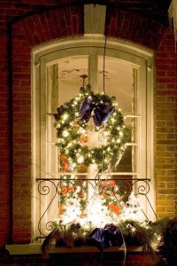 A Window Dressed with the Christmas Wreath & Lights